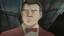 a man in a red suit and bow tie