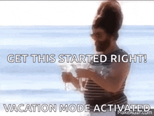 a man with a beard is holding a glass of wine on the beach and says get this started right vacation mode activated .