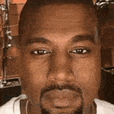 a close up of a man 's face with a beard and mustache .