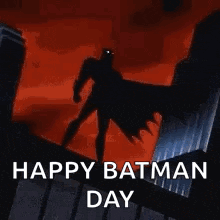 a picture of a batman standing on top of a building with the words `` happy batman day '' .