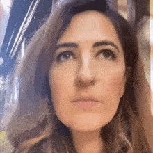a woman with a serious look on her face