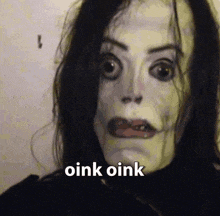 a close up of a person 's face with the words oink oink written on the bottom