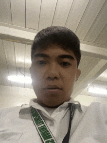 a man with a lanyard around his neck that says " university of the philippines "