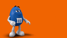 a blue m & ms character stands in front of an orange background that says how ironic