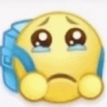 a yellow smiley face is crying with tears coming out of its eyes while holding a blue backpack .