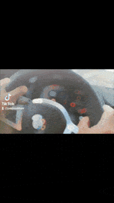 a tiktok video of a person adjusting the steering wheel