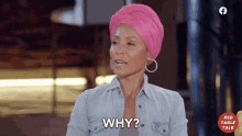 a woman wearing a pink turban is asking the question why