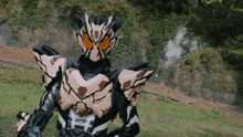 a cartoon character with a h on his chest is standing in a field