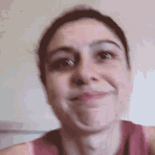 a close up of a woman making a face
