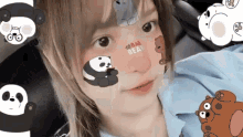 a close up of a woman 's face with stickers of panda bears and grizzly bears on her face .