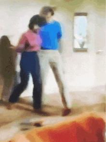 a blurry painting of two people dancing in a living room