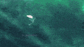 a ninja is flying through the air with a green lightning bolt coming out of his chest .