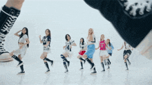 a group of girls wearing knee high boots and converse sneakers