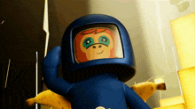 a cartoon character wearing a blue helmet and holding a banana