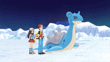 a boy and a girl stand next to a blue pokemon