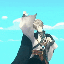 a man in a kimono is standing in front of a blue sky .