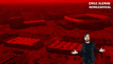 a man in a suit is standing in front of a red background that says emile aleman @emileappeal