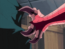 a close up of a monster 's claws with a huge mouth