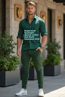 a man wearing a green shirt with the words noapte buna on it