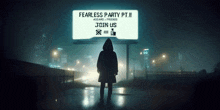 a person standing in front of a sign that says fearless party pt ii
