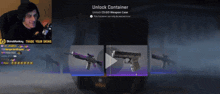 a man is sitting in front of a screen that says " unlock container "