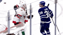 the number 38 is on the back of a hockey player 's jersey