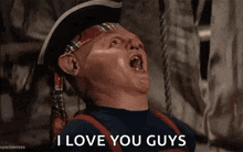 a cartoon character is saying `` i love you guys '' while wearing a pirate hat and bandana .