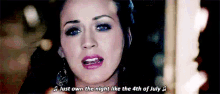 a close up of a woman 's face with a quote that says `` just own the night like the 4th of july '' .