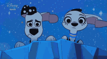 two dalmatian dogs looking over a blue box with disney premiere written on the bottom