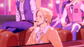 a group of people are sitting in a row and one of them is wearing a pink vest with a rose on it
