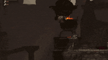 a dark room with two pots of fire and a statue