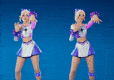 two cheerleaders are holding a white heart between them