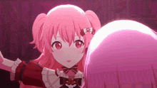 a girl with pink hair and red eyes is standing next to another girl with pink hair .