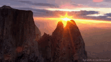 mountains cliff sun scene