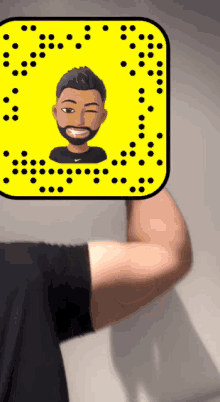 a man 's arm is visible behind a yellow square with a cartoon of a man on it