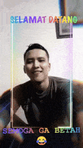 a picture of a man with the words " selamat datang " on it