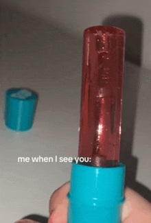 a person is holding a lip balm that says me when i see you on it