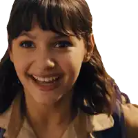 a close up of a girl 's face smiling with a white background