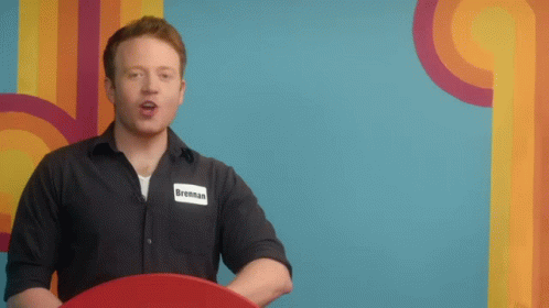 a man wearing a name tag that says brennan on it