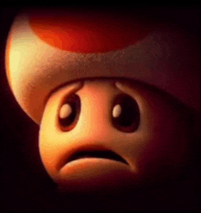 a cartoon mushroom with a sad face on it .