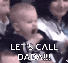 a baby is crying in a crowd of people and says `` let 's call dada !!! ''