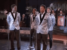 Man Looking GIF - Man Looking Silver Suit GIFs
