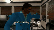 a man in a blue suit is talking on a cell phone with the words you 're shitting me right below him