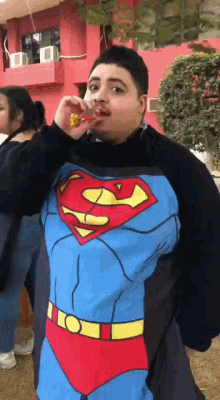 Diab Super Man Costume GIF - Diab Super Man Costume Blow Party Horn GIFs
