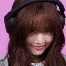 a woman wearing a pair of sony headphones on her head