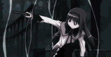 a girl with long black hair is holding a sword .
