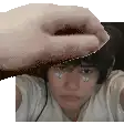 a pixelated image of a person 's face with a hand reaching for it .