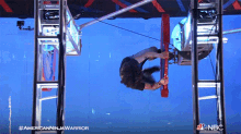 hanging on american ninja warrior from one side to another changing sides from left to right