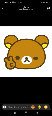 a phone screen shows a picture of a teddy bear giving the middle finger