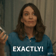 a woman in a blue shirt says exactly